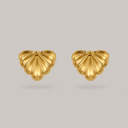 Pair of gold heart-shaped earrings on a light gray background