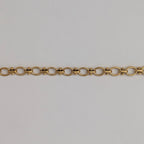 Gold chain  bracelet on a light gray background
