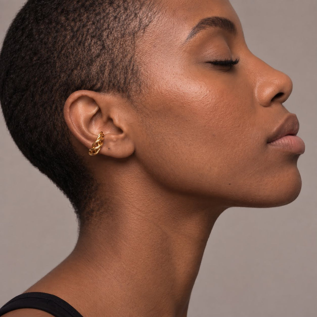 Spirali Ear Cuff in PVD gold-plated stainless steel by DeMANI