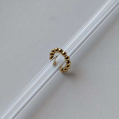 Gold beaded ear cuff beside ruler showing 1.54 cm diameter mini size reference.