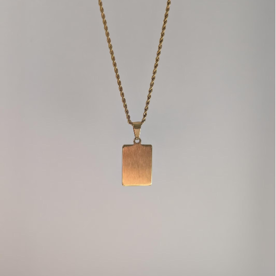 Alternate back angle of gold letter medallion pendant highlighting polished 18k plating and lobster clasp detail.