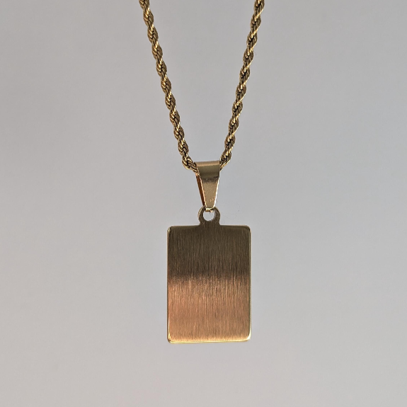 Back view of gold medallion letter necklace showing smooth pendant reverse and sturdy rope‑chain clasp.