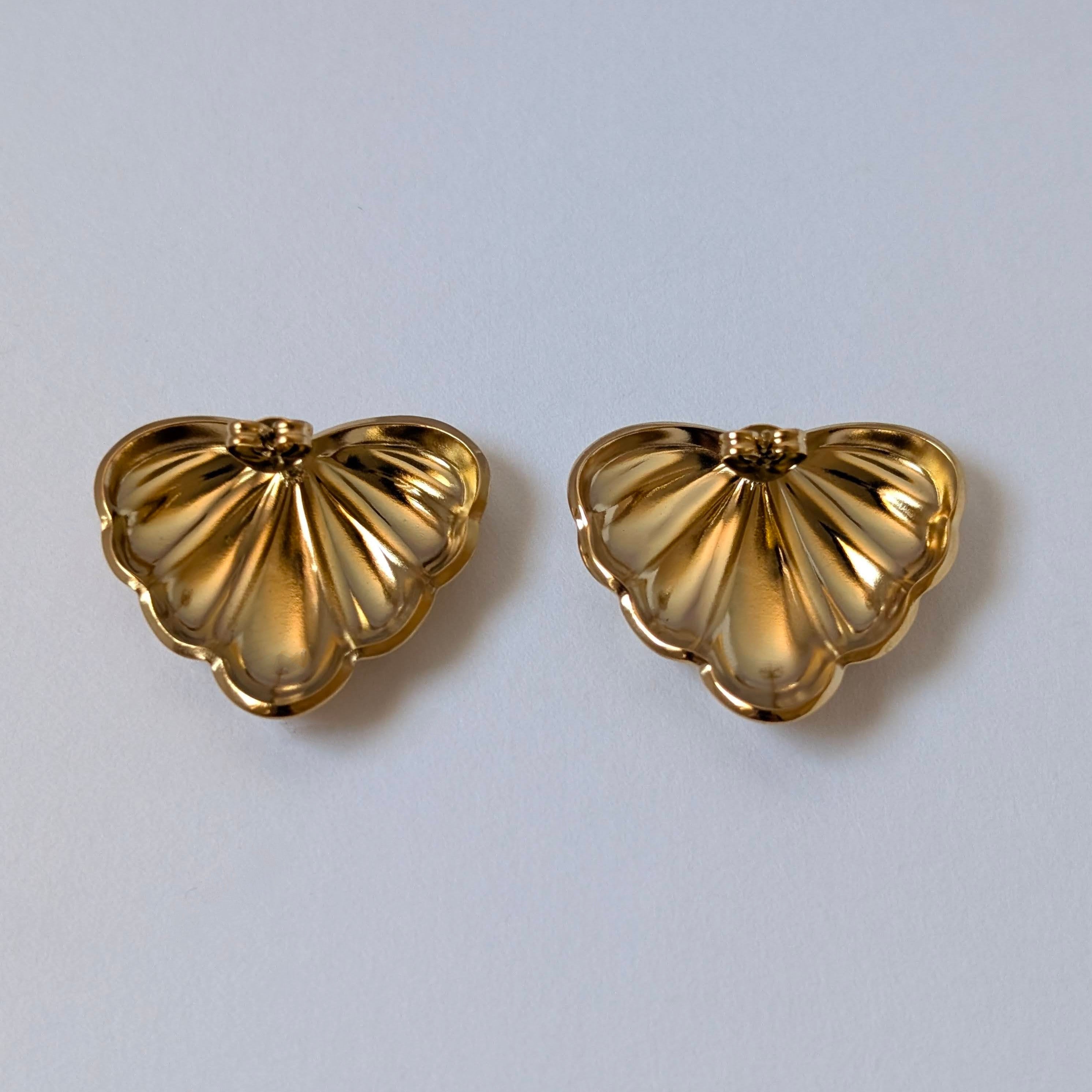 Back view with stainless‑steel post and butterfly clasp on gold palm leaf earrings.