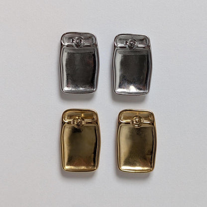 Back view of gold and silver chunky rectangle stud earrings—smooth reverse, stainless‑steel butterfly clasps.