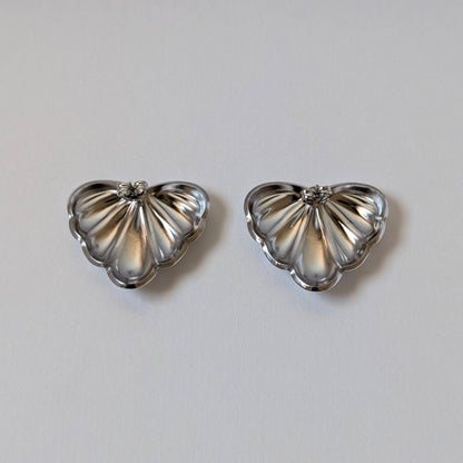 Back view showing secure post and stainless‑steel butterfly clasp of silver palm leaf earrings.
